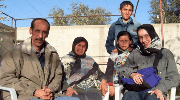 A picture of the extended Nasrallah family with Rachel Corrie, seated.